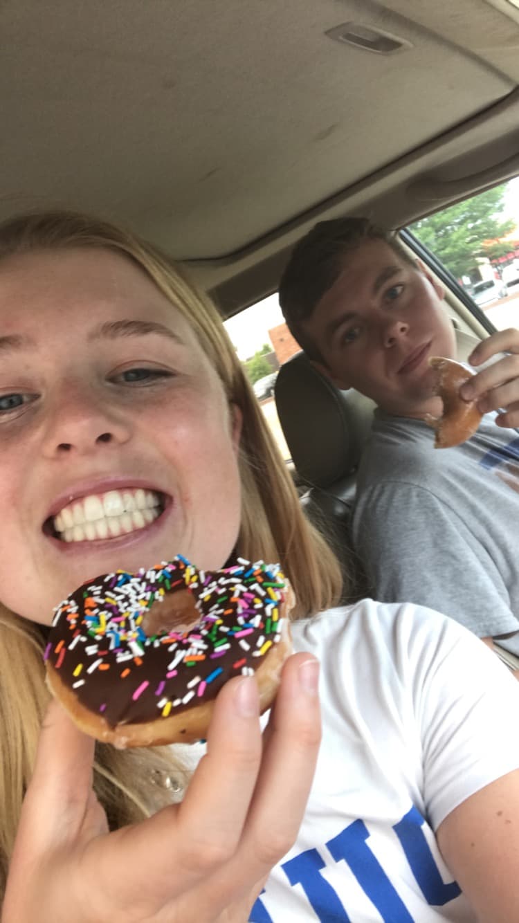 Kaitlyn and Chris sharing donuts